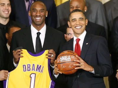 Barack Obama poses with Los Angeles Lakers star Kobe Bryant in the East Room 